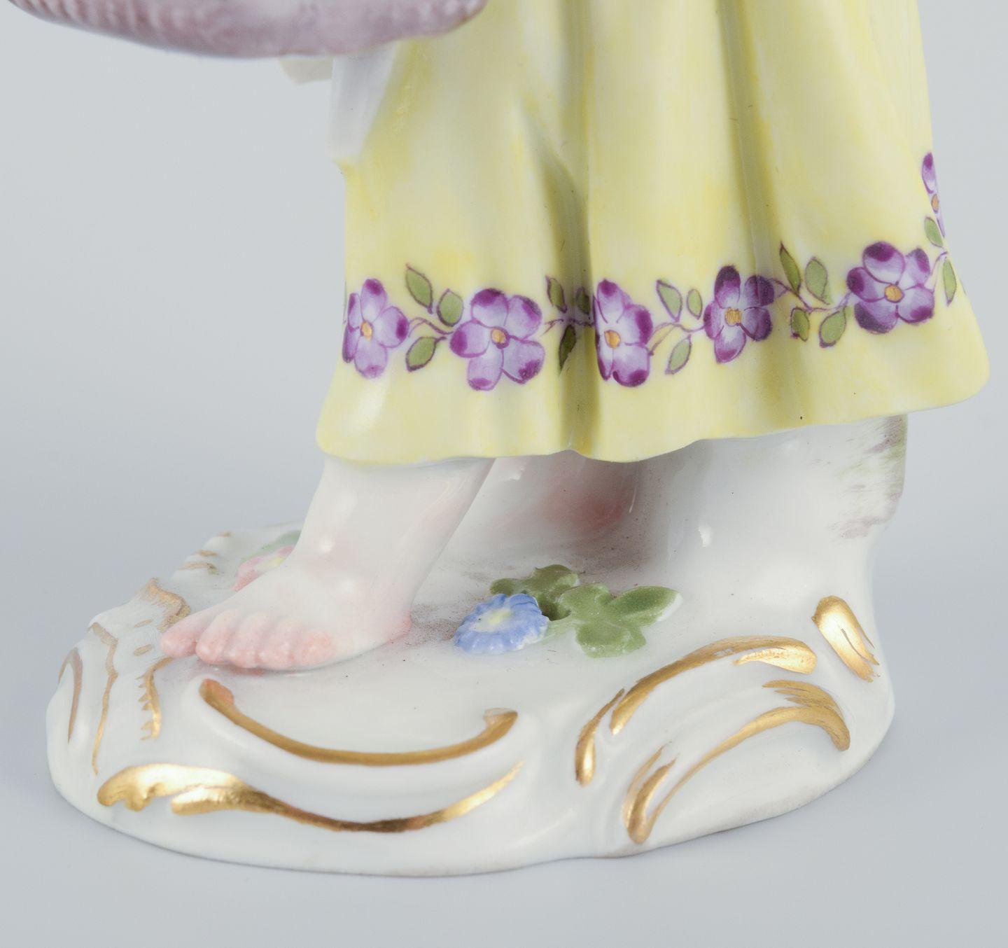 20th Century Meissen, Germany. Porcelain figurine of girl with basket. Ca 1900 For Sale