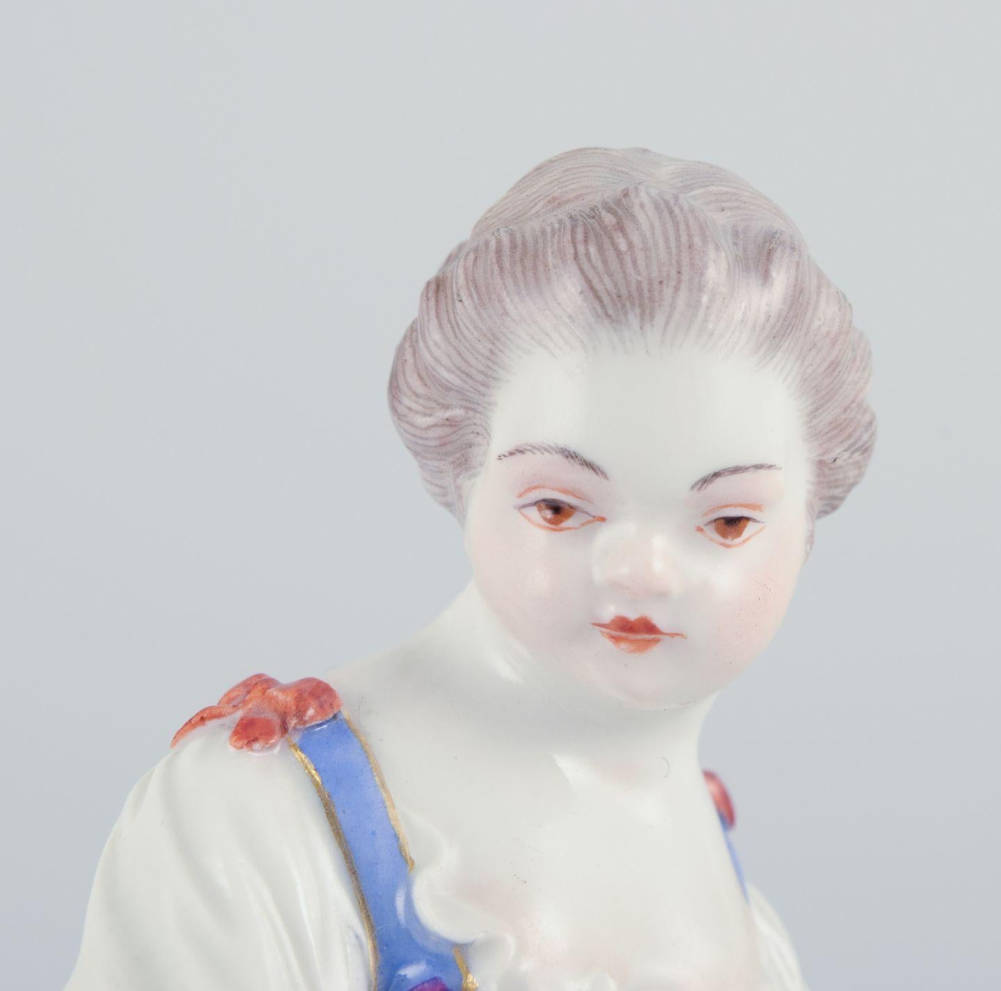 20th Century Meissen, Germany. Porcelain figurine of girl with basket. Ca 1900 For Sale