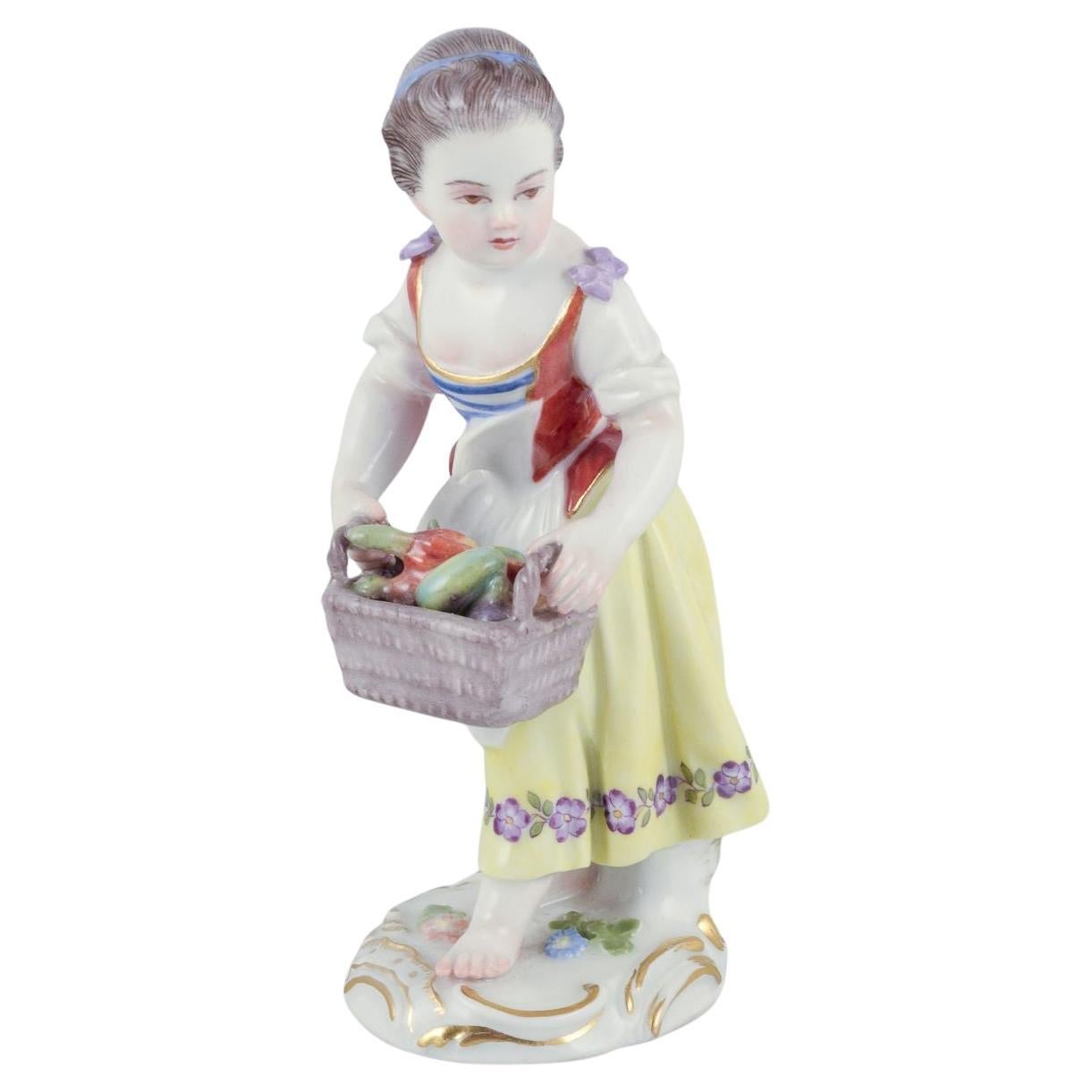 Meissen, Germany. Porcelain figurine of girl with basket. Ca 1900 For Sale