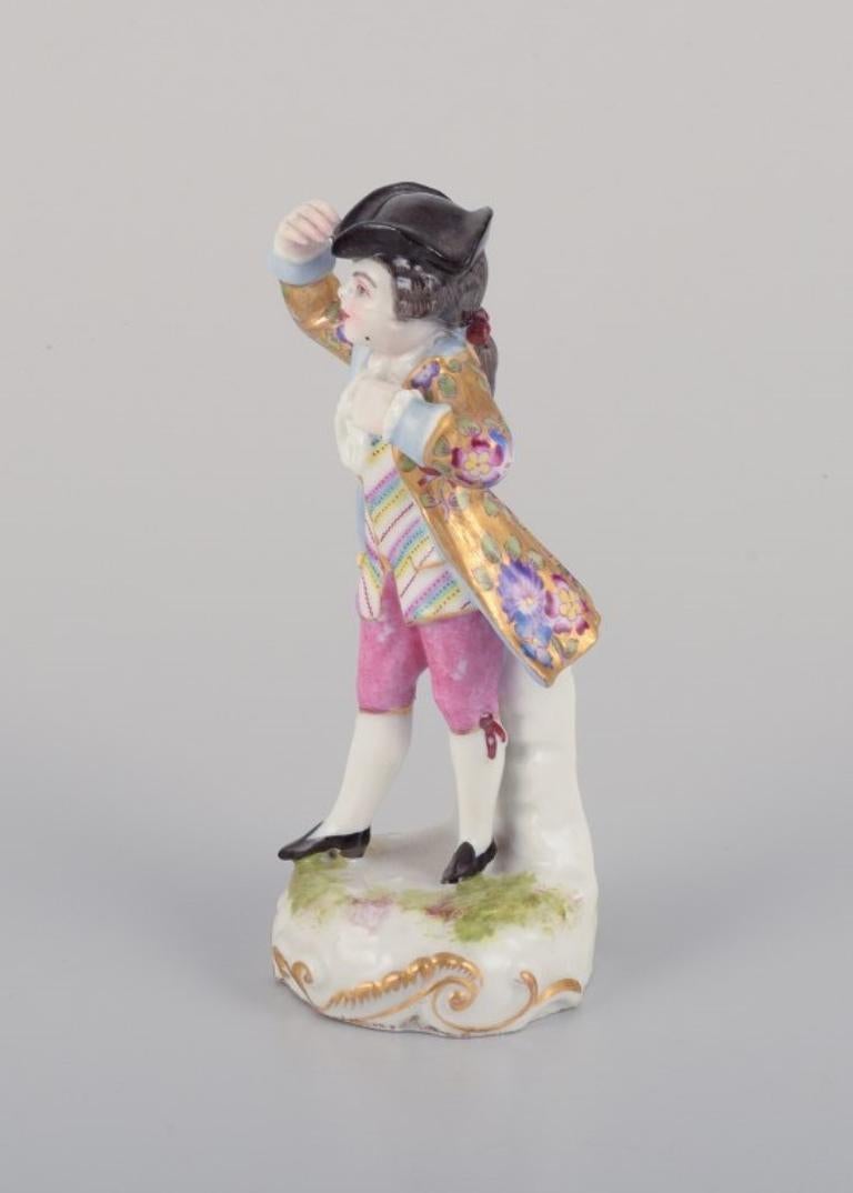 Rococo Meissen, Germany. Porcelain figurine of young man in elegant attire. For Sale