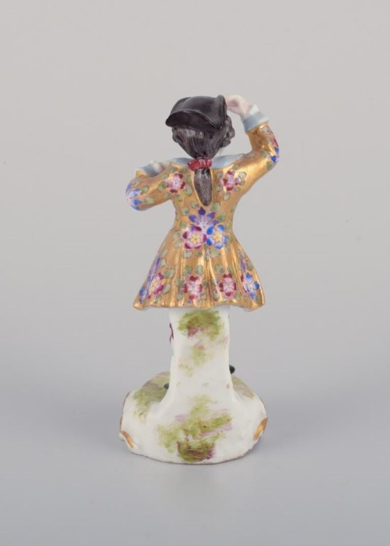 Hand-Painted Meissen, Germany. Porcelain figurine of young man in elegant attire. For Sale