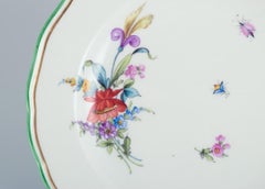 Meissen, Germany, porcelain plate hand-painted with floral motifs and insects.