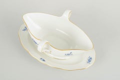 Meissen, Germany. Porcelain sauce boat with blue floral motifs and gilt accents.