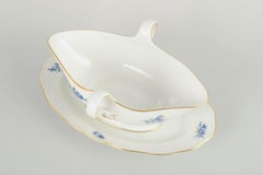Meissen, Germany. Porcelain sauce boat with blue floral motifs and gilt accents.