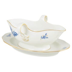 Meissen, Germany. Porcelain sauce boat with blue floral motifs and gilt accents.