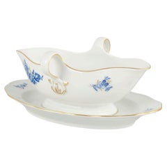 Meissen, Germany. Porcelain sauce boat with blue floral motifs and gilt accents.