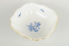 Meissen, Germany. Porcelain square bowl with blue floral motifs and gilt edge.