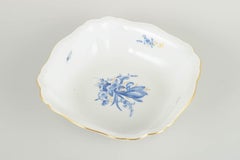 Meissen, Germany. Porcelain square bowl with blue floral motifs and gilt edge.