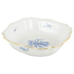 Meissen, Germany. Porcelain square bowl with blue floral motifs and gilt edge.