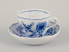 Meissen, Germany. Set of four Blue Onion demitasse cups with saucers.