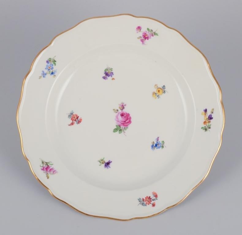 Meissen, Germany. A set of four dinner plates in porcelain, hand-painted with different polychrome flower motifs and a gold rim.
Early 1900s.
Marked.
First factory quality.
In perfect condition.
Dimensions: Diameter 24.6 cm x Height 3.5 cm.