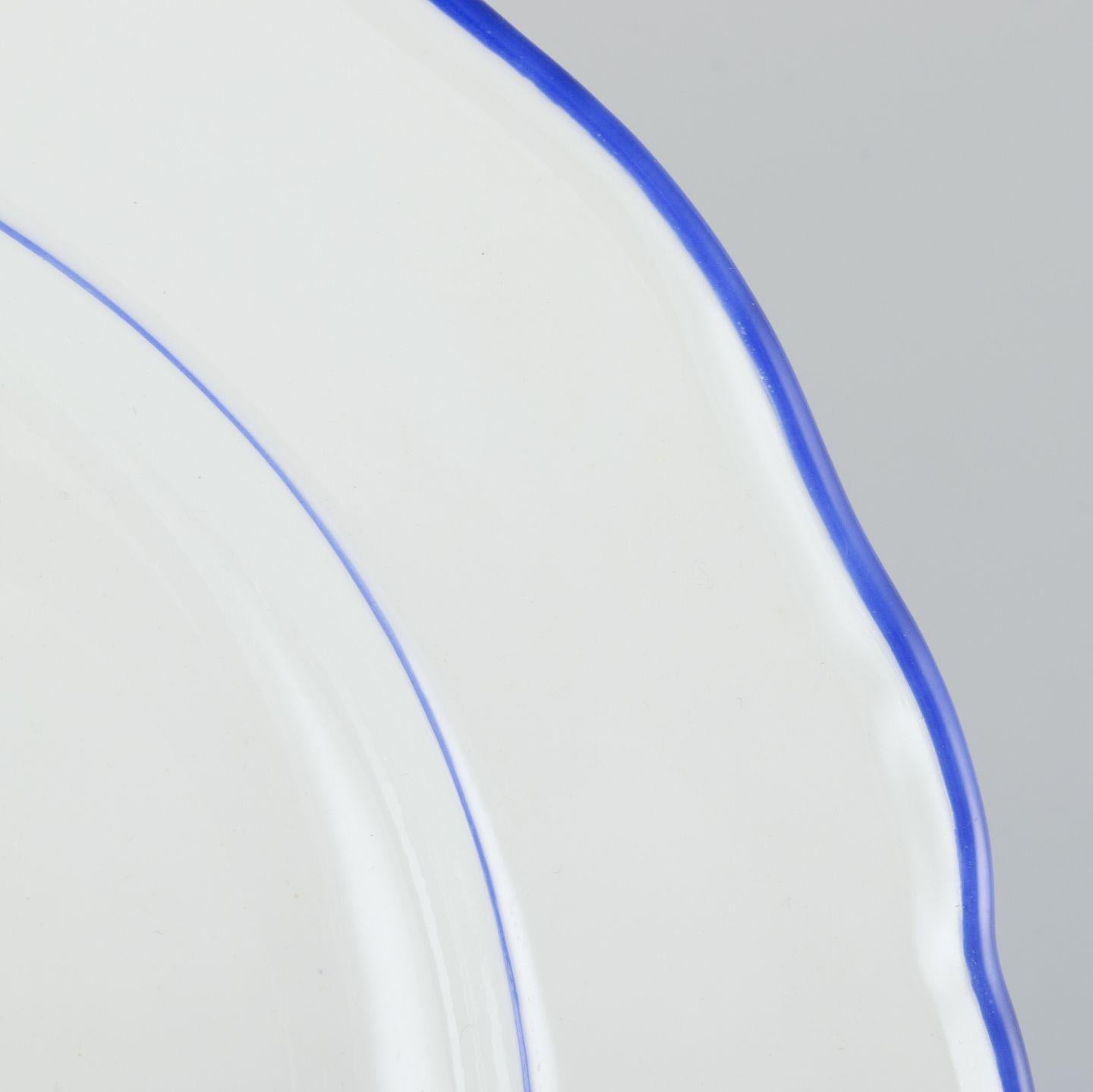 Glazed Meissen, Germany. Set of four dinner plates. White porcelain with blue rim. For Sale