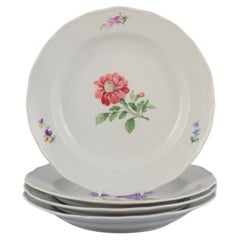 Meissen, Germany. Set of four dinner plates with floral motifs.