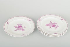 Meissen, Germany. Set of four porcelain lunch plates with lilac floral motif.