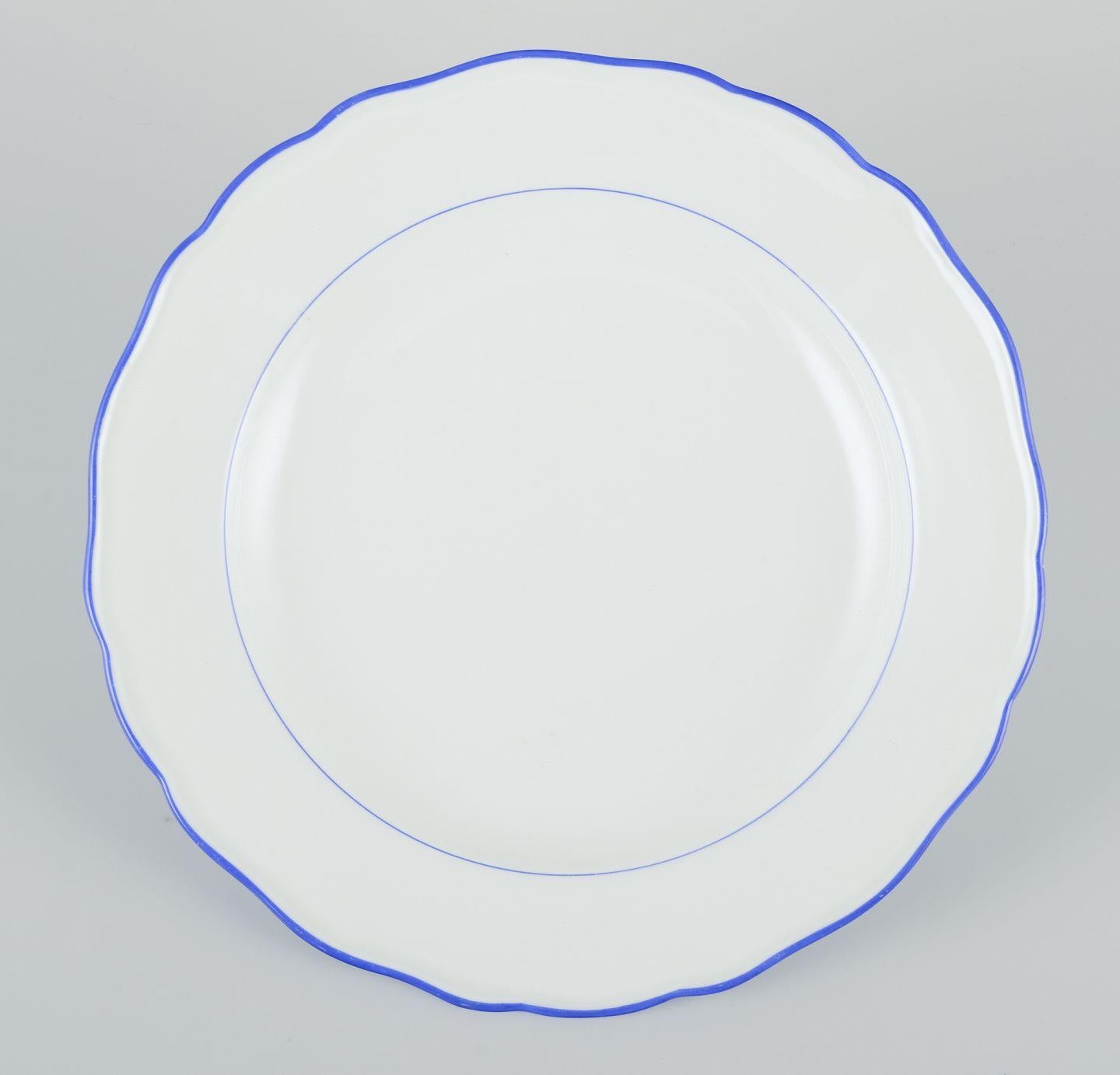 20th Century Meissen, Germany. Set of six dinner plates. White porcelain with blue rim. For Sale