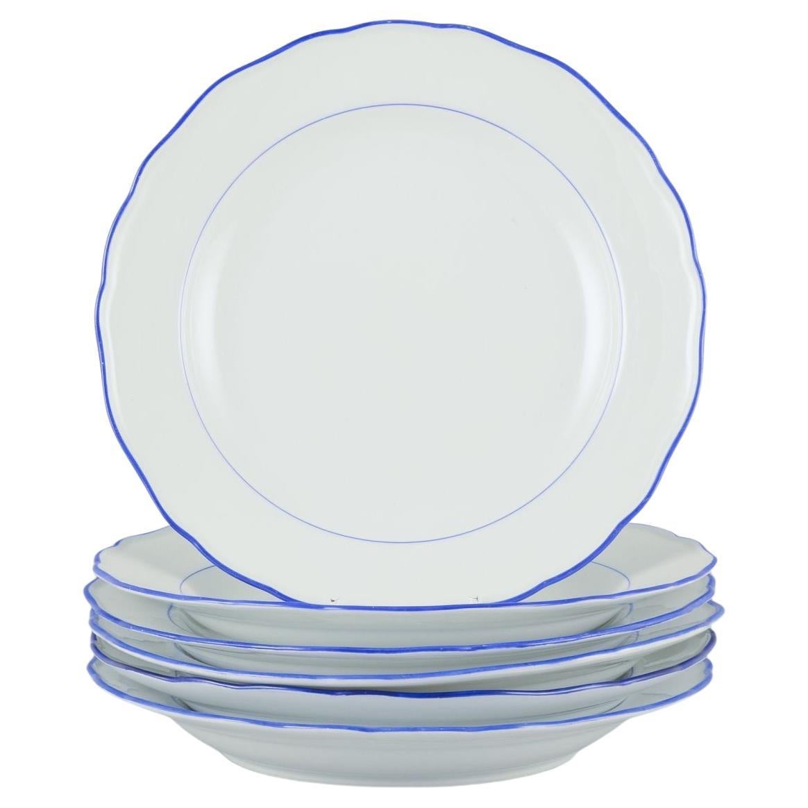 Meissen, Germany. Set of six dinner plates. White porcelain with blue rim.