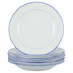 Meissen, Germany. Set of six dinner plates. White porcelain with blue rim.