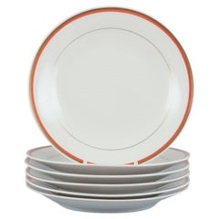 Meissen, Germany. Set of six plates. Orange and gold-decorated rim. 1930/1940s