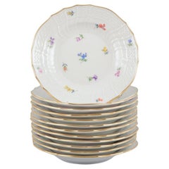 Meissen, Germany. Set of twelve porcelain plates with floral motifs.