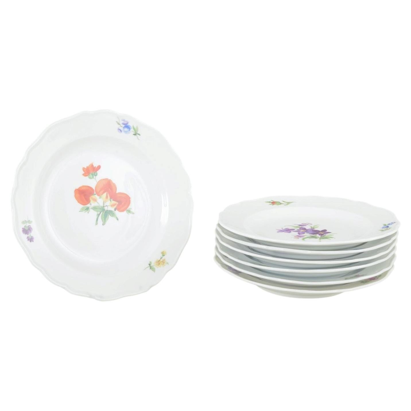 Meissen, Germany. Seven porcelain plates with floral decoration. Ca. 1930s