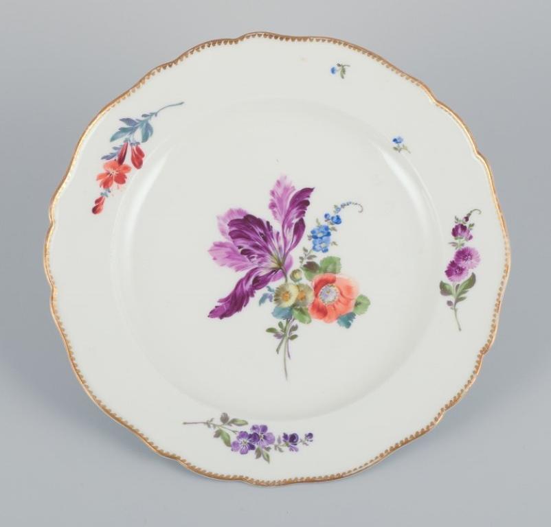 Meissen, Germany. A set of six antique porcelain dinner plates. 
Hand-painted with polychrome floral motifs.
Dating: circa 1800.
Marked with the Marcolini mark.
First factory quality.
In excellent condition with minimal signs of use. One plate has a