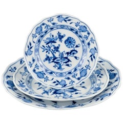 Meissen, Germany, three Blue Onion pattern plates in different sizes.