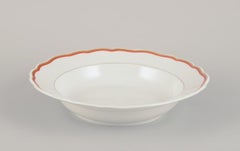 Meissen, Germany. Three-piece porcelain set: a large bowl and two plates.