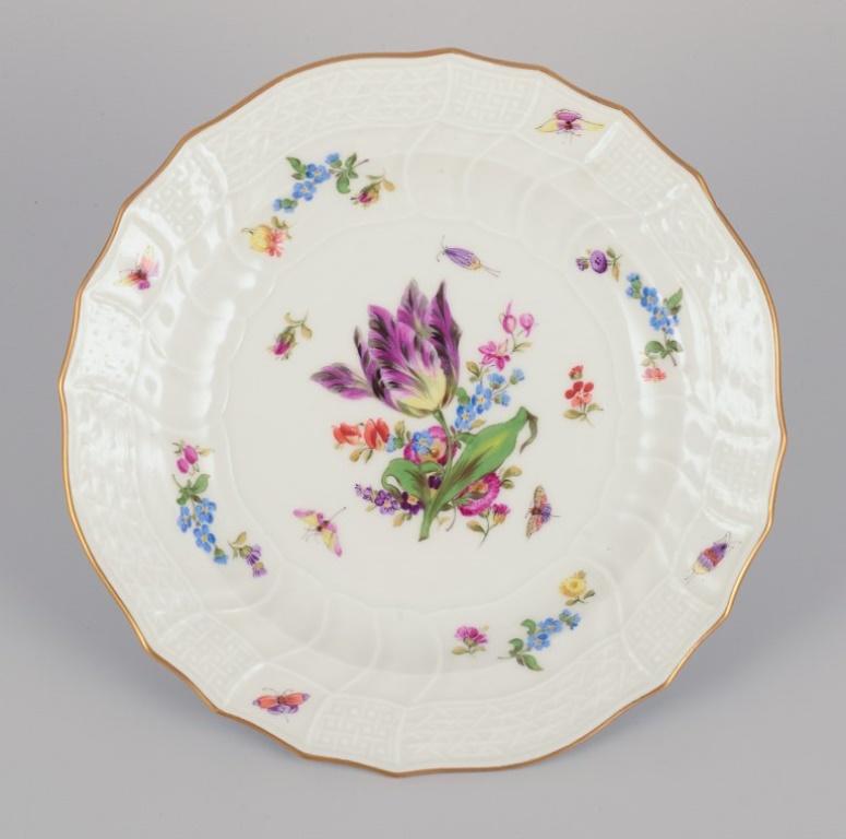 Meissen, Germany. Three plates in porcelain, hand-painted with different polychrome flowers and butterflies, and a gold rim.
Early 1900s.
Marked.
Third factory quality.
In beautiful condition, except for one plate with hairline cracks (see