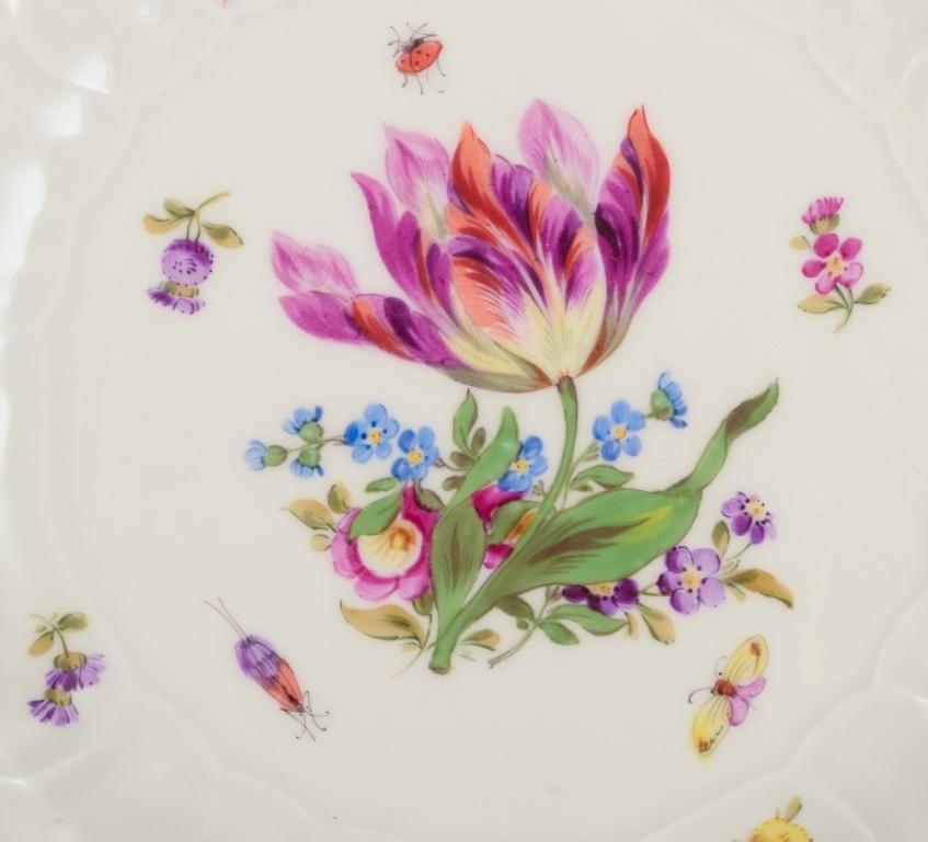 20th Century Meissen, Germany. Three plates in porcelain with flowers and butterflies For Sale