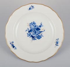 Meissen, Germany. Three porcelain plates with blue flowers and insects