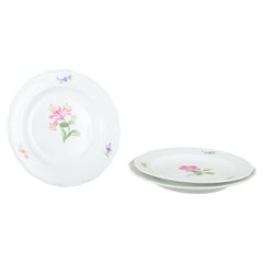 Meissen, Germany. Three porcelain salad plates with floral decoration. Ca. 1930s