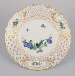 Meissen, Germany. Two open lace plates in porcelain, decorated with exotic bird