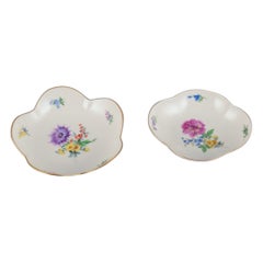 Meissen, Germany. Two porcelain bowls hand-painted with polychrome flowers.