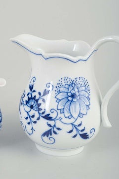 Meissen, Germany. Two porcelain creamers. 'Blue Onion' pattern. Early 20th c.