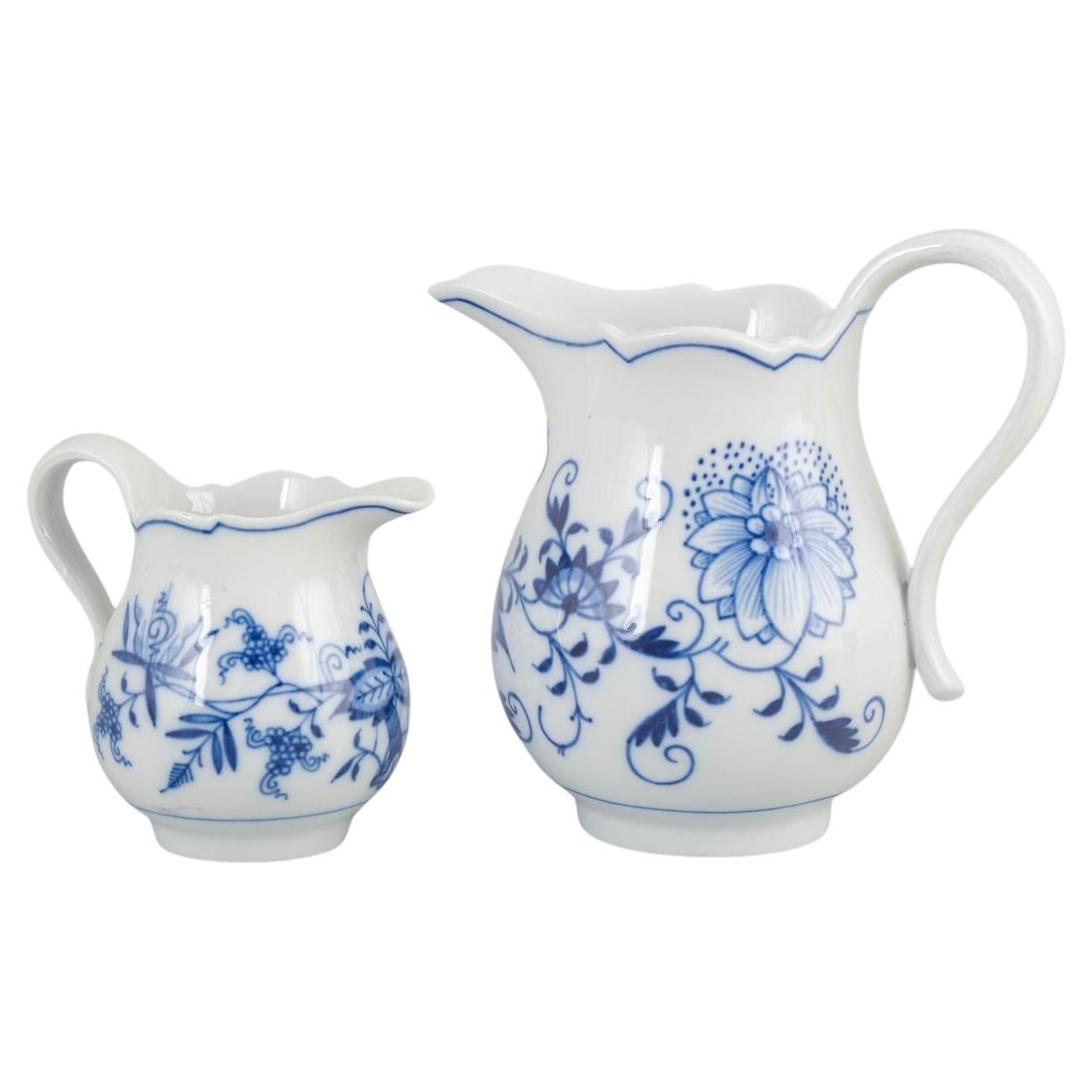 Meissen, Germany. Two porcelain creamers. 'Blue Onion' pattern. Early 20th c.