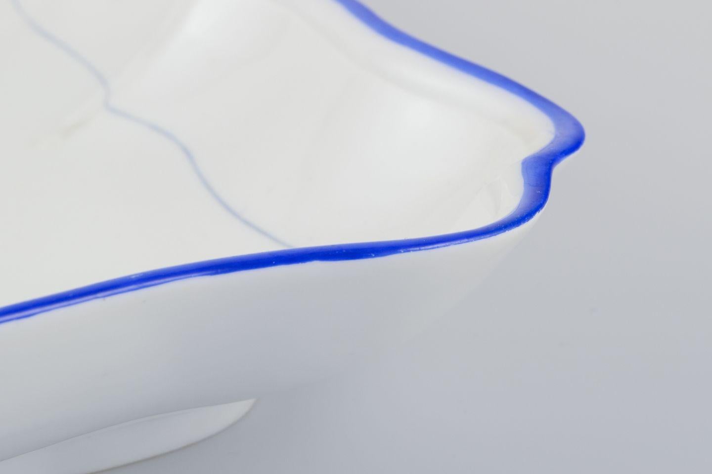 Glazed Meissen, Germany. Two square bowls of white porcelain, blue rim. Early 20th C. For Sale