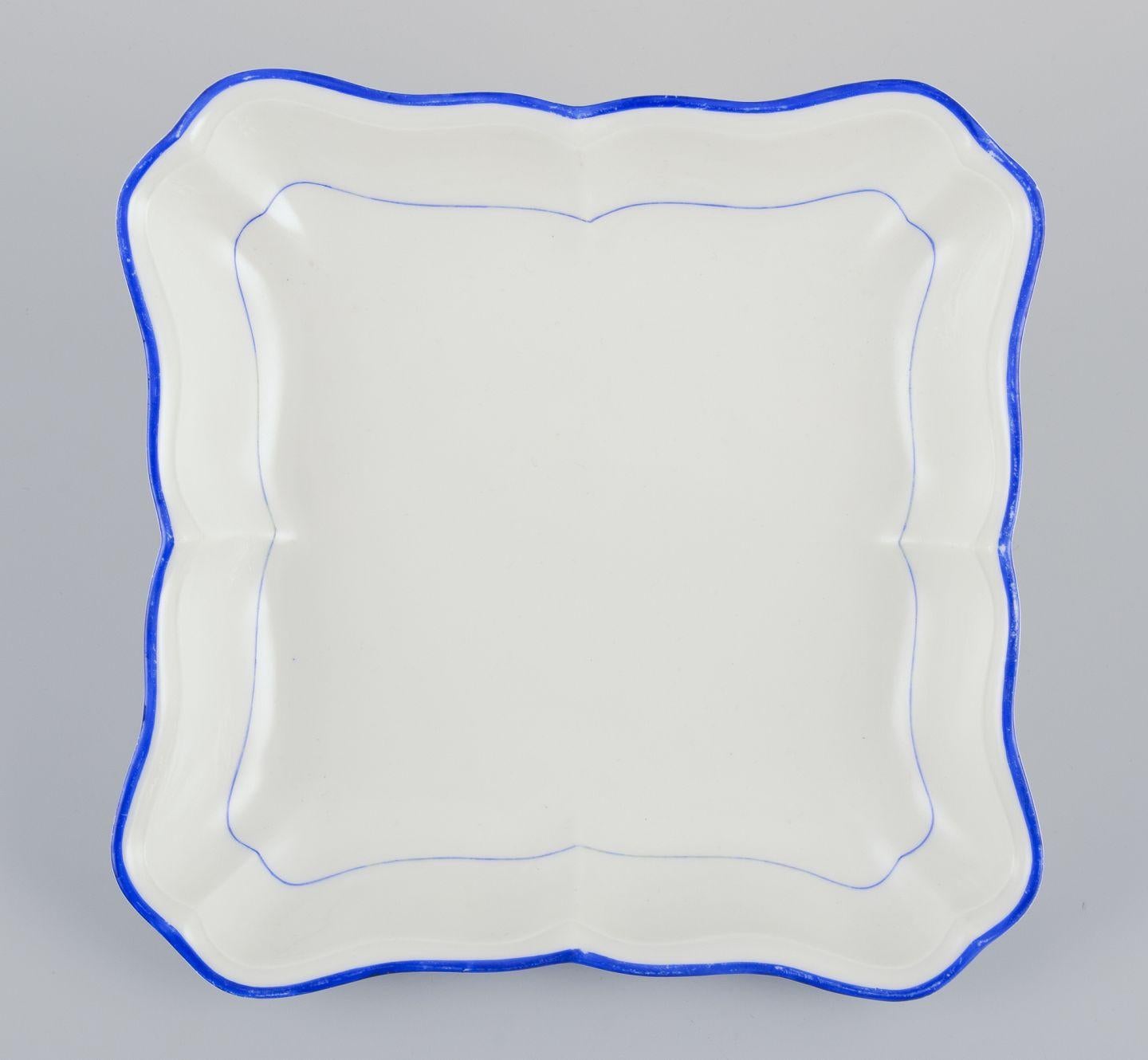 Porcelain Meissen, Germany. Two square bowls of white porcelain, blue rim. Early 20th C. For Sale