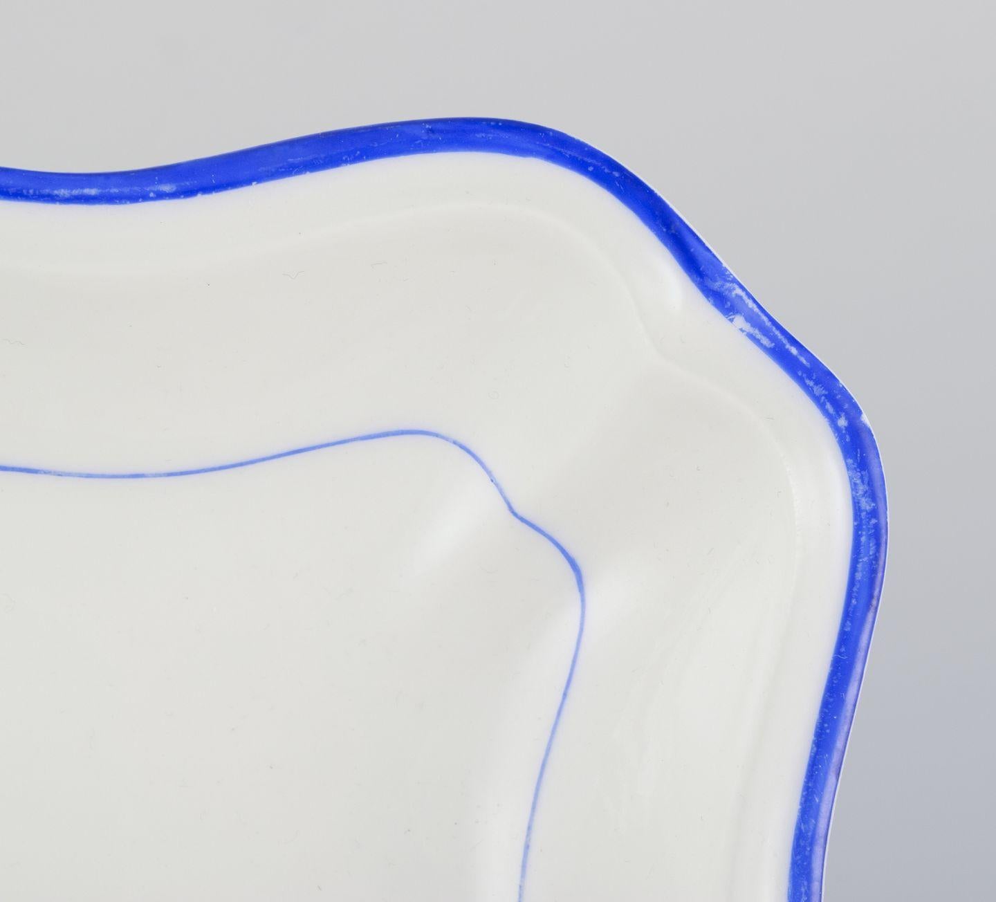 Meissen, Germany. Two square bowls of white porcelain, blue rim. Early 20th C. For Sale 1