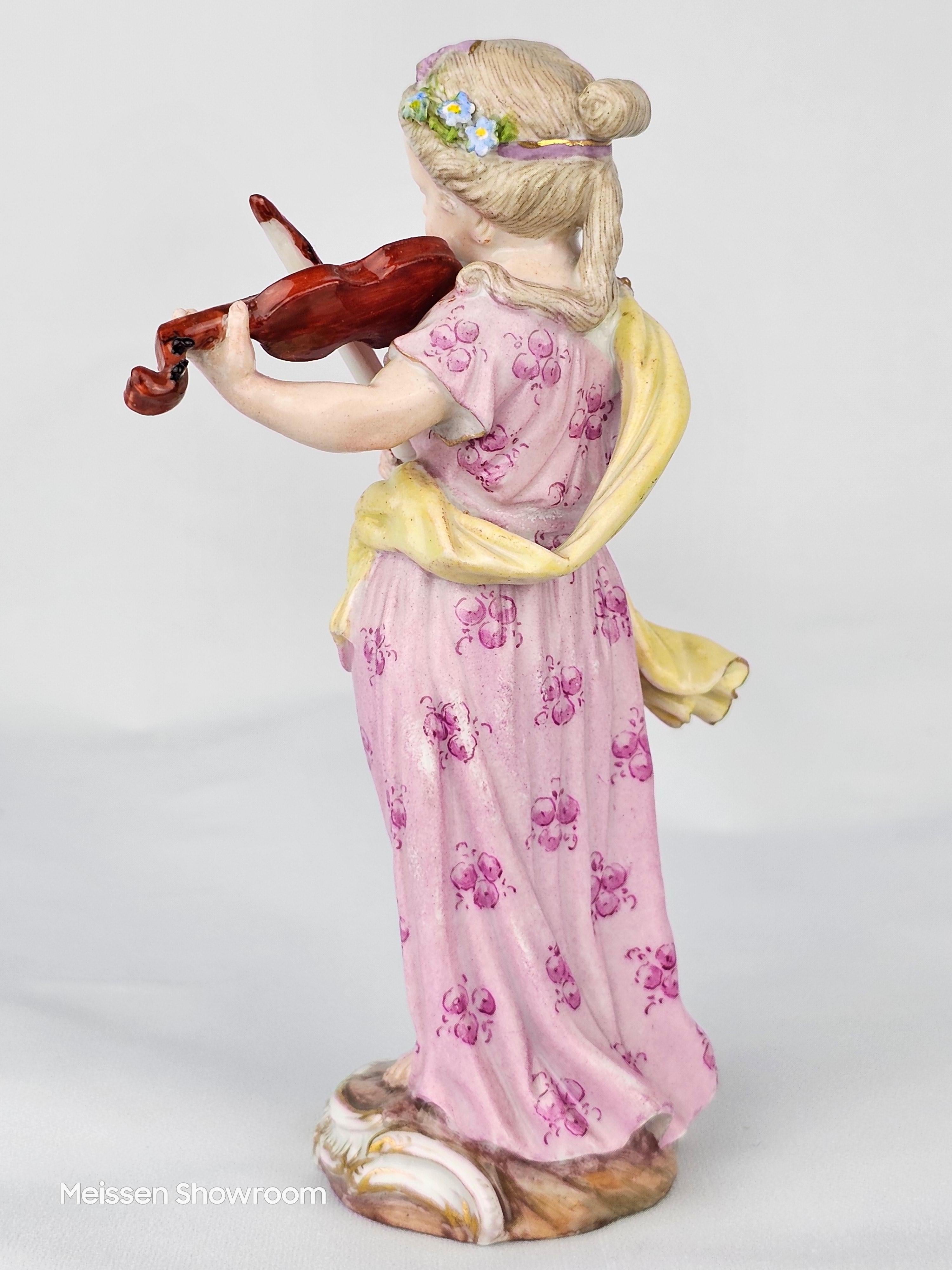 Meissen Girl playing violin from the ‘Girl Orchestra’ series by J.J Kaendler circa 1757.

Circa early 19c

Height 14cm

Model Number 2550

Underglaze blue crossed swords