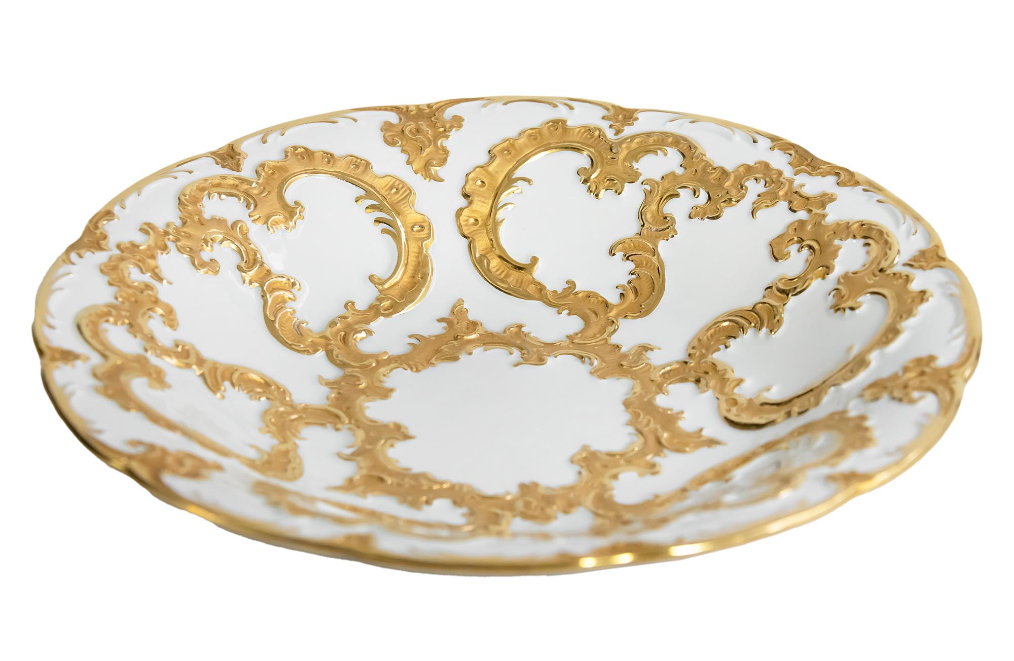 Meissen porcelain plate richly decorated with gold decor.