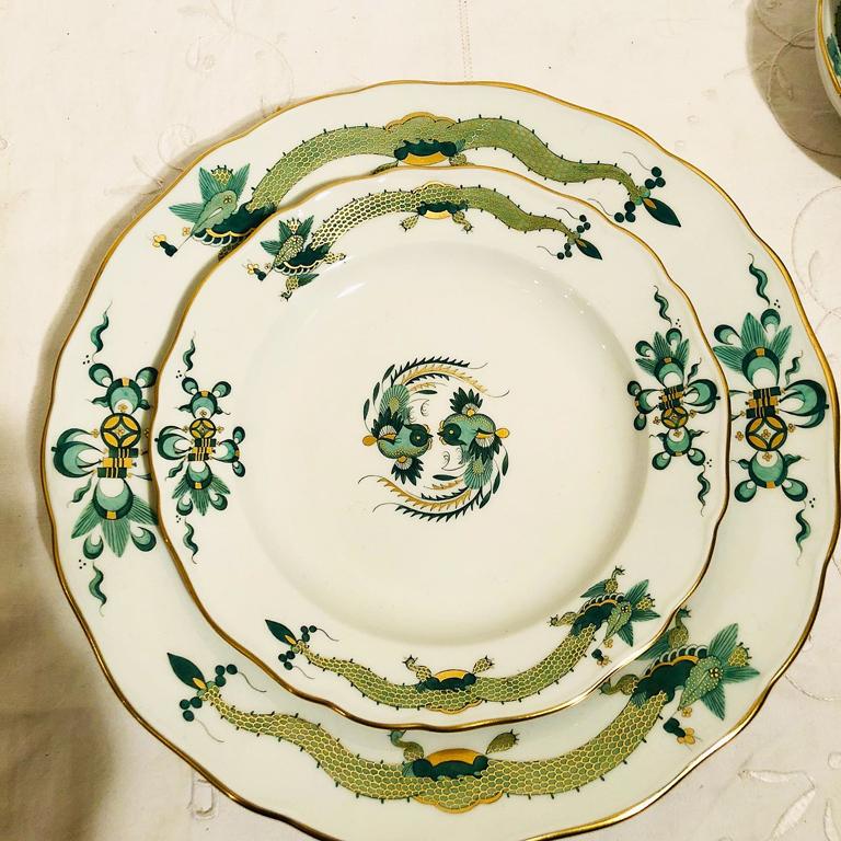 We are proud to offer you this Meissen green court dragon dinner service for fourteen people. It includes fourteen cups and saucers, fourteen cake plates and fourteen dinner plates. We are counting the cups and saucers as two pieces. Therefore,