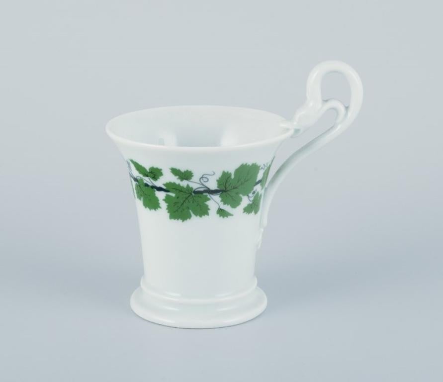 German Meissen, Green Ivy Vine. Two coffee cups with tall handles shaped like swans. For Sale