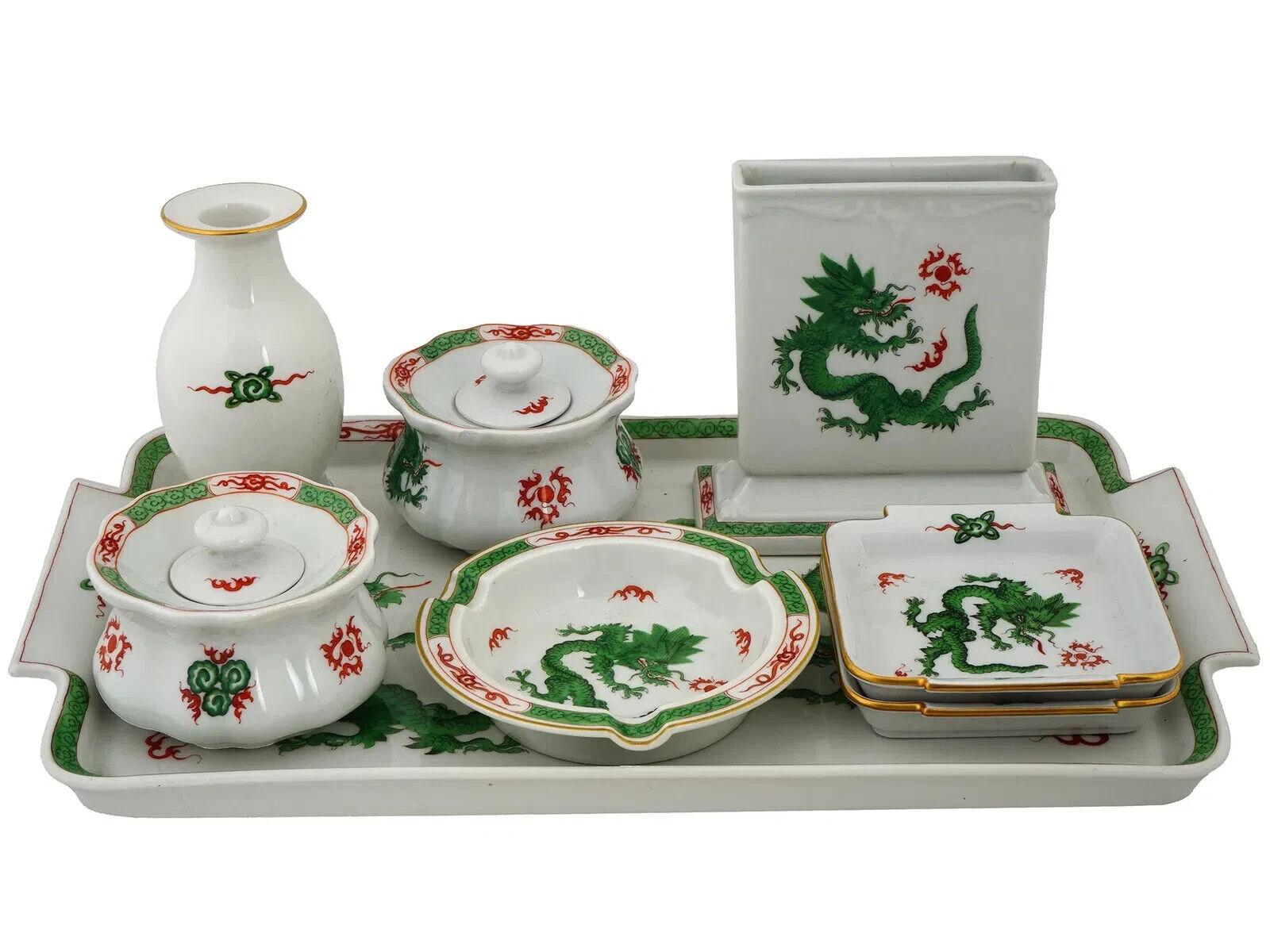 A mid-20th century hand-painted porcelain desk accessories set by Meissen Porzellan, a prominent German porcelain manufacture. Ming Dragon pattern in Green. A total of 9 items, including two lidded inkwells, an ink blotter, an ashtray, a pen holder,