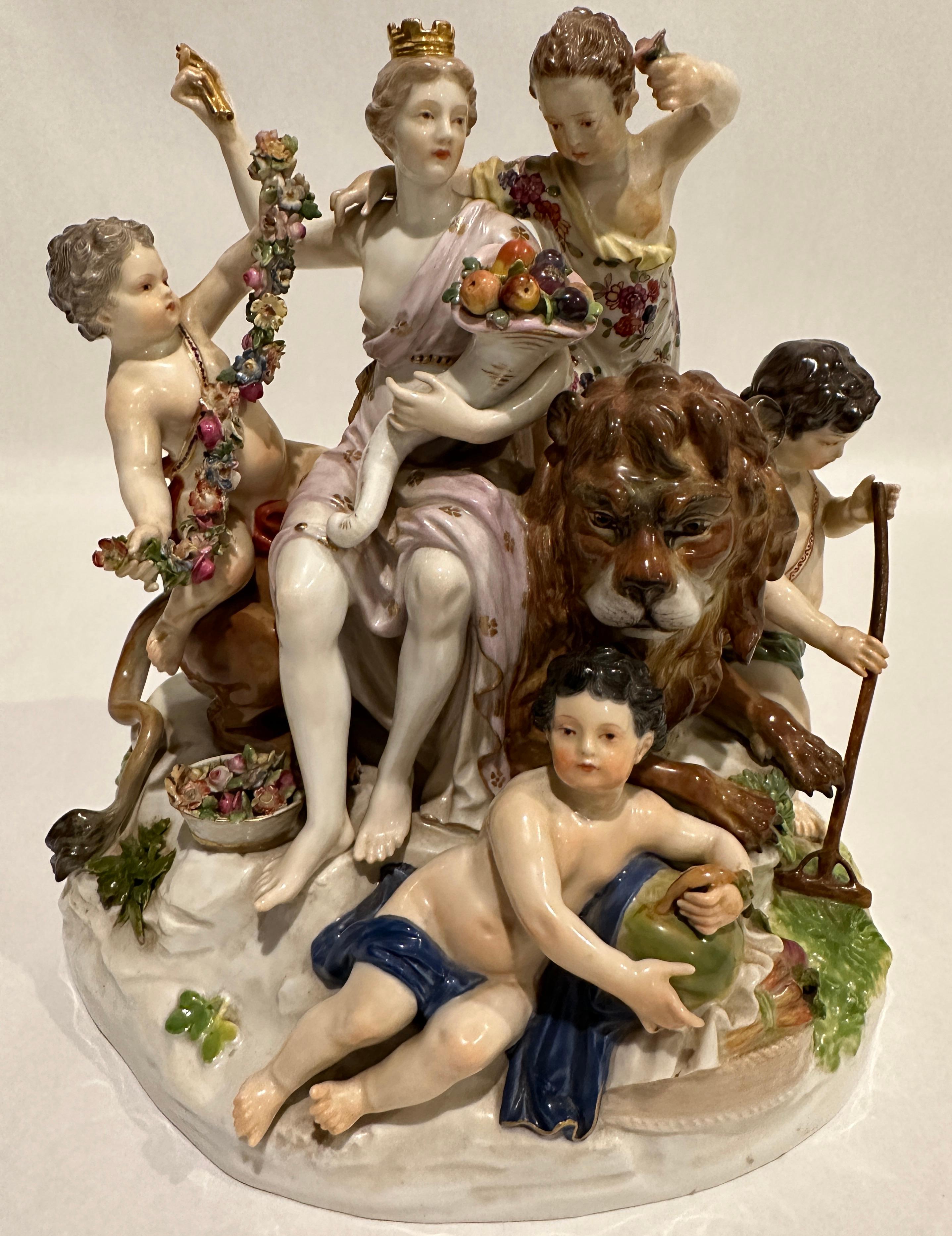 Large Meissen group of figurines which are Allegory of Earth assembled around a Lion's Figurine. 
Manufactory: Meissen Hallmarked: Blue Meissen Sword Mark (underglazed) First quality model number D 83 / painter's number 49 / former's number 65