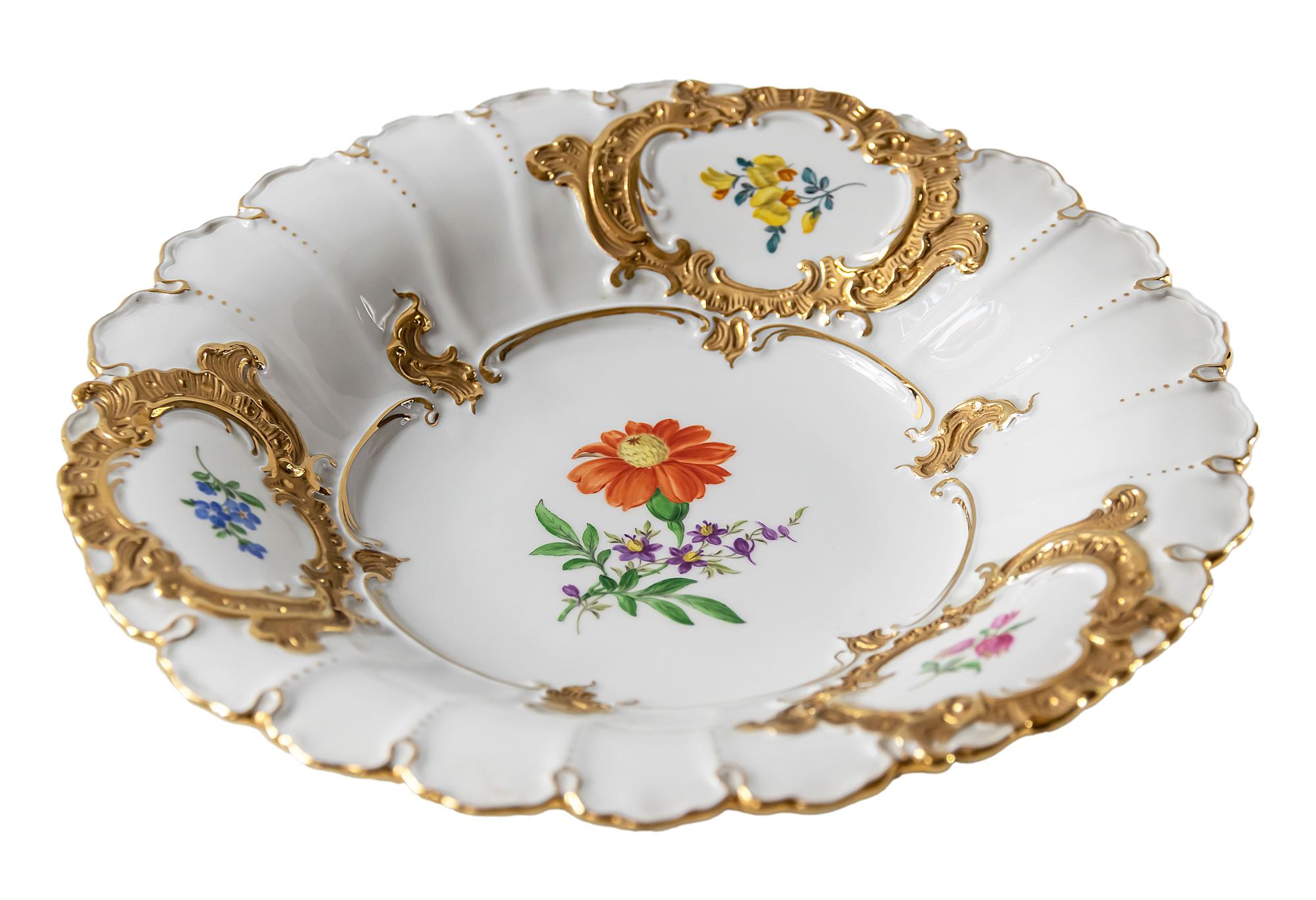 Large deep Meissen Porcelain plate with hand painted floral motives and gold decor.