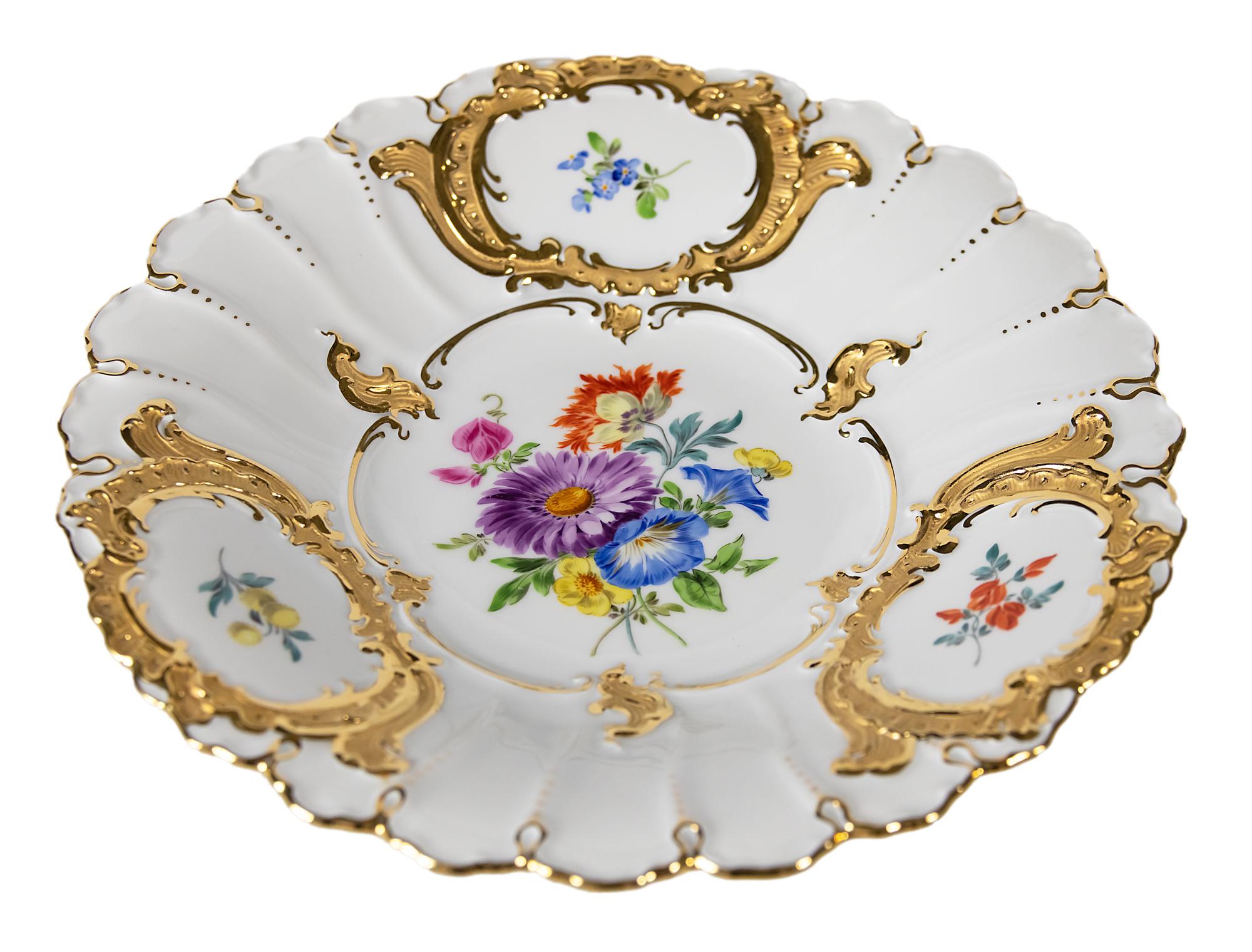 Meissen Porcelain plate with hand painted floral motives and gold decor.