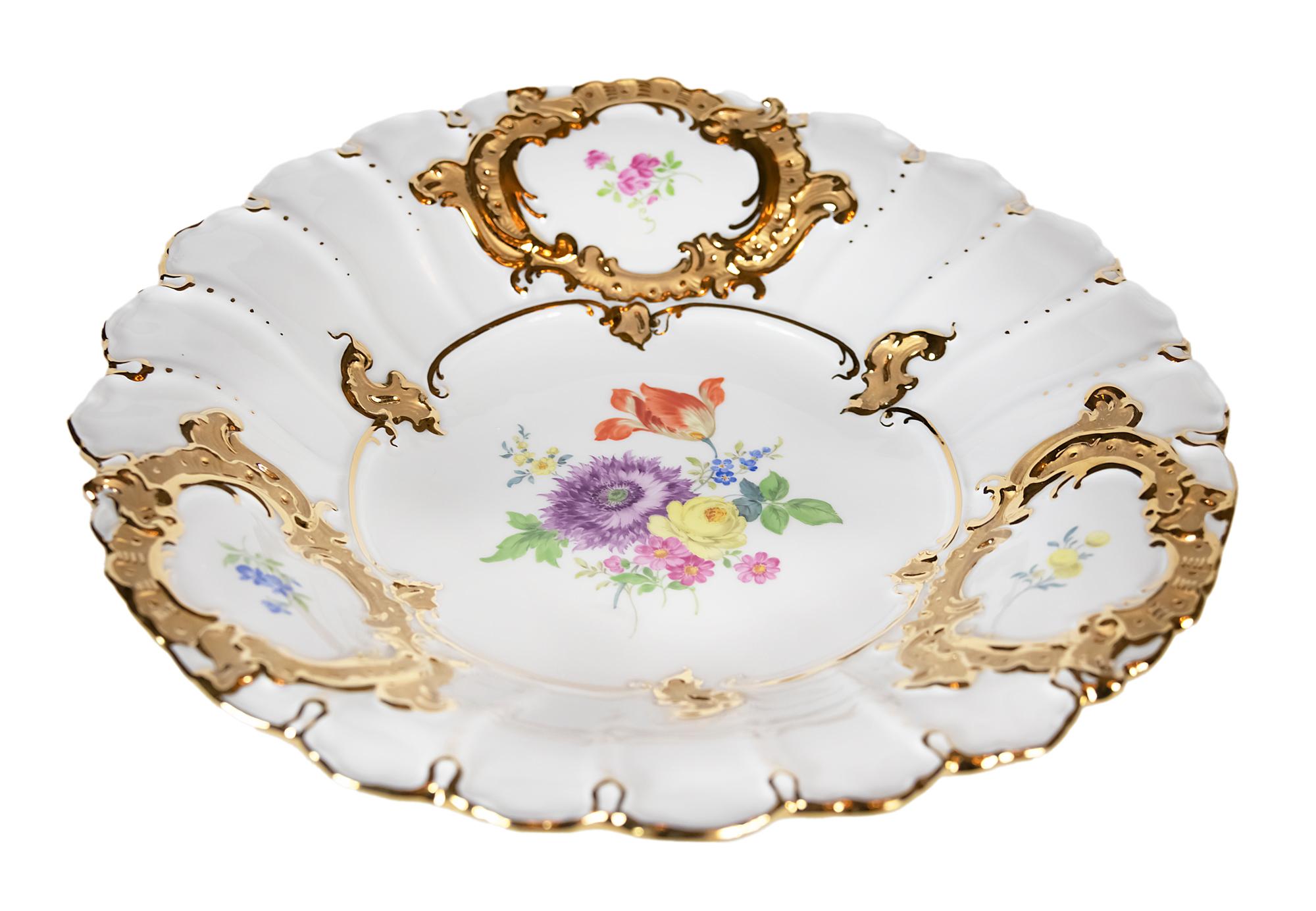 Meissen Porcelain plate with hand painted floral motives and gold decor.