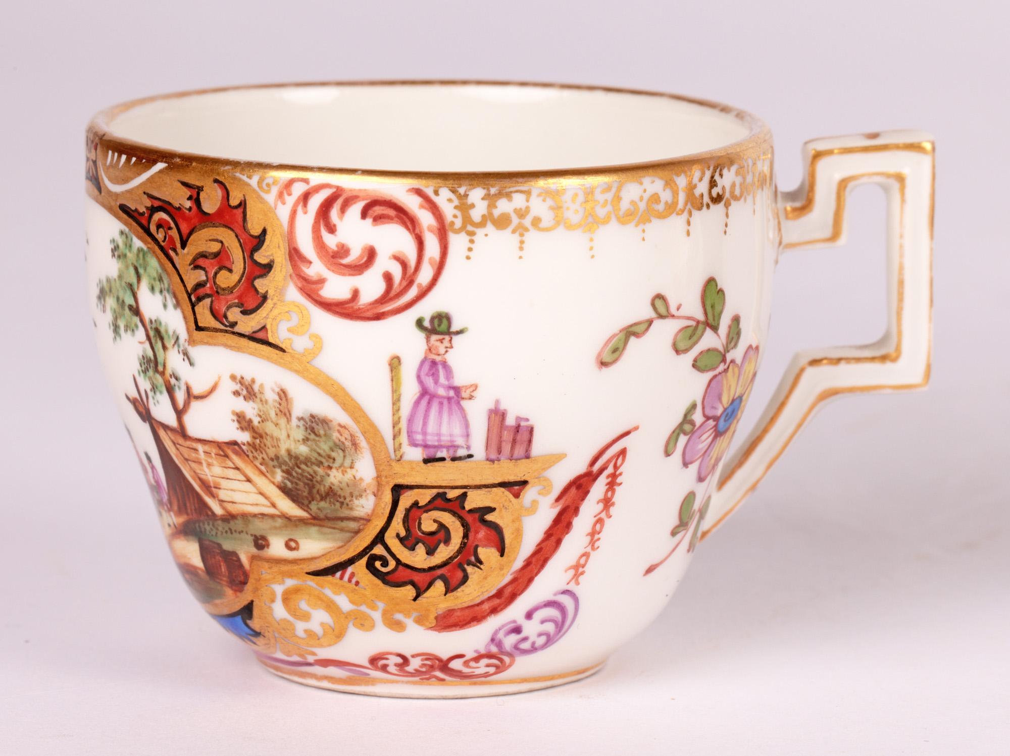 A very fine German Meissen porcelain cabinet coffee cup and saucer hand painted with shipping scenes dating from the 19th century. The cup is of small round shape standing on a narrow unglazed foot with recessed base and with a square angle shaped