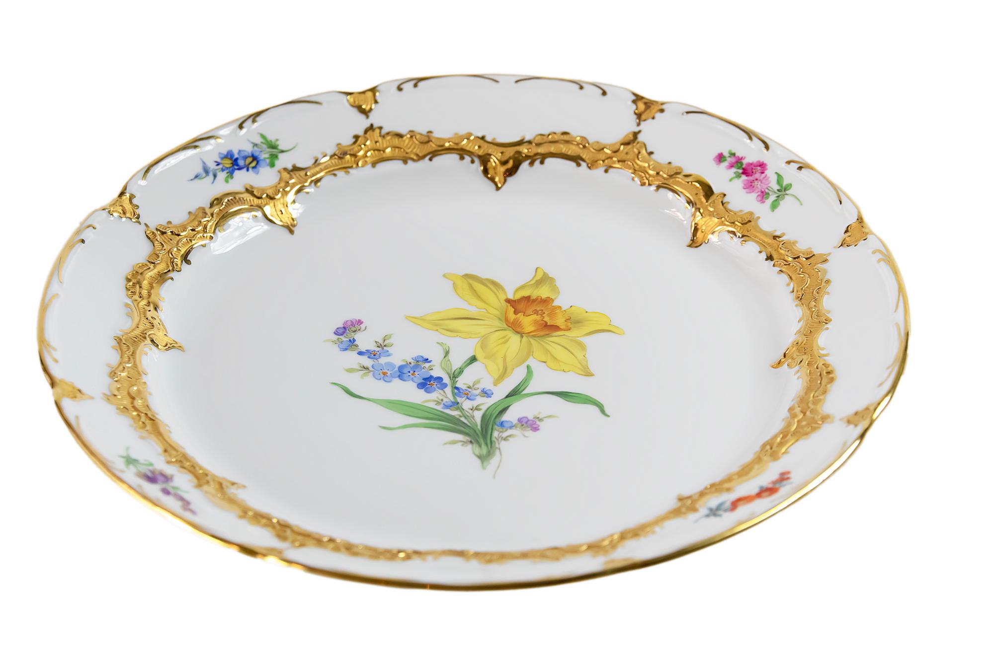 Meissen porcelain plate with hand painted floral motives and gold decor.