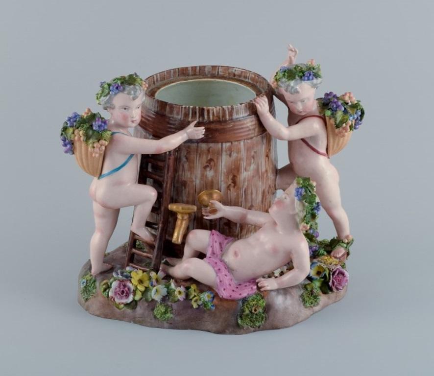 Large European antique porcelain figure group. 
Bacchanalia with putti and a wine barrel.
19 c.
In excellent condition with a few older restorations on the moulded flowers.
Marked.
Dimensions: H 33.5 cm.  L 28.5 cm. x  D 19.5 cm.